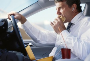 Man Eating in Car